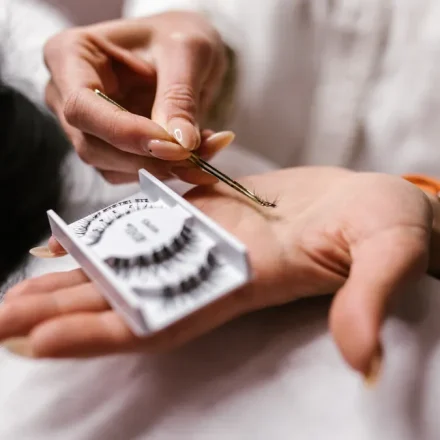 close-up of eyelash extensions and tweezers