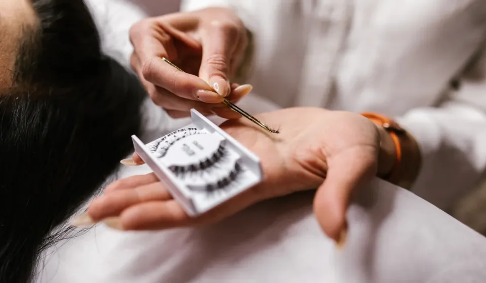 close-up of eyelash extensions and tweezers