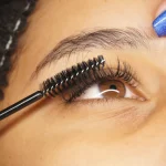Close-up of eyelash extension application on an eye